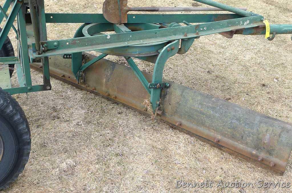 Pull behind road grader with 9' blade that swivels and tilts. Height and bevel adjustment works.