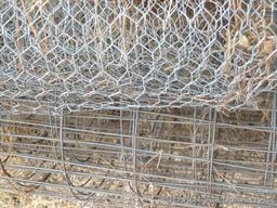 Two rolls of garden fence, plus a small roll of chicken wire. Fence up to 6', squares measure 2"x4"