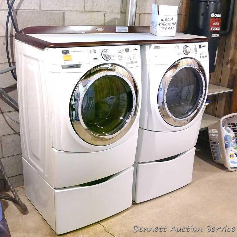 Maytag 5000 Series washer and dryer with storage bases and work top. Washer Model MHWE550WW01, dryer