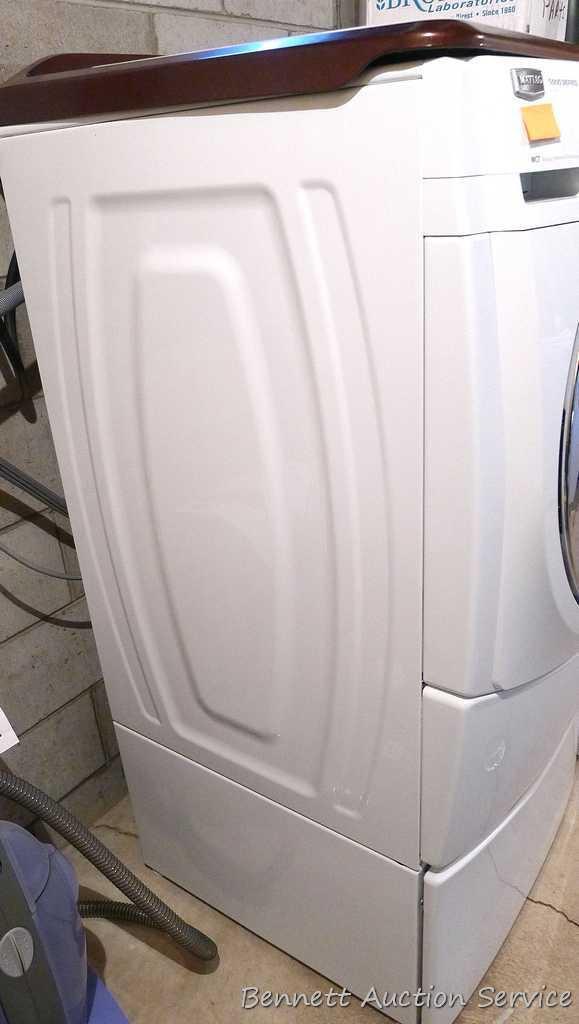 Maytag 5000 Series washer and dryer with storage bases and work top. Washer Model MHWE550WW01, dryer