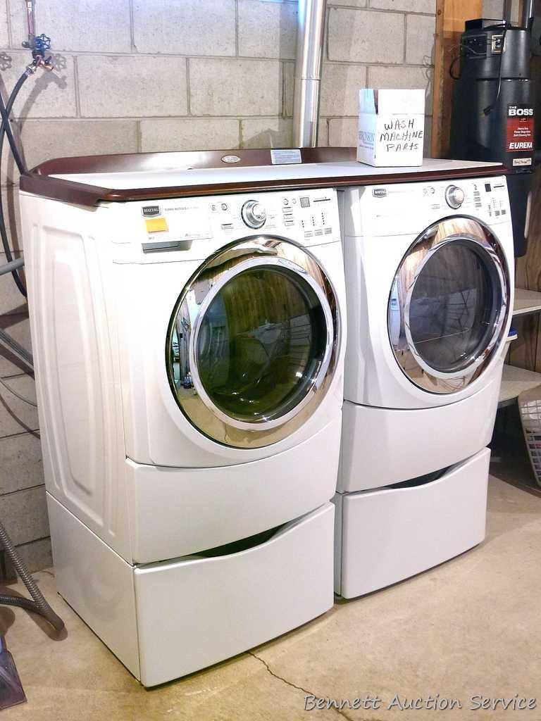 Maytag 5000 Series washer and dryer with storage bases and work top. Washer Model MHWE550WW01, dryer