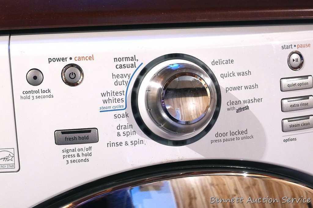 Maytag 5000 Series washer and dryer with storage bases and work top. Washer Model MHWE550WW01, dryer