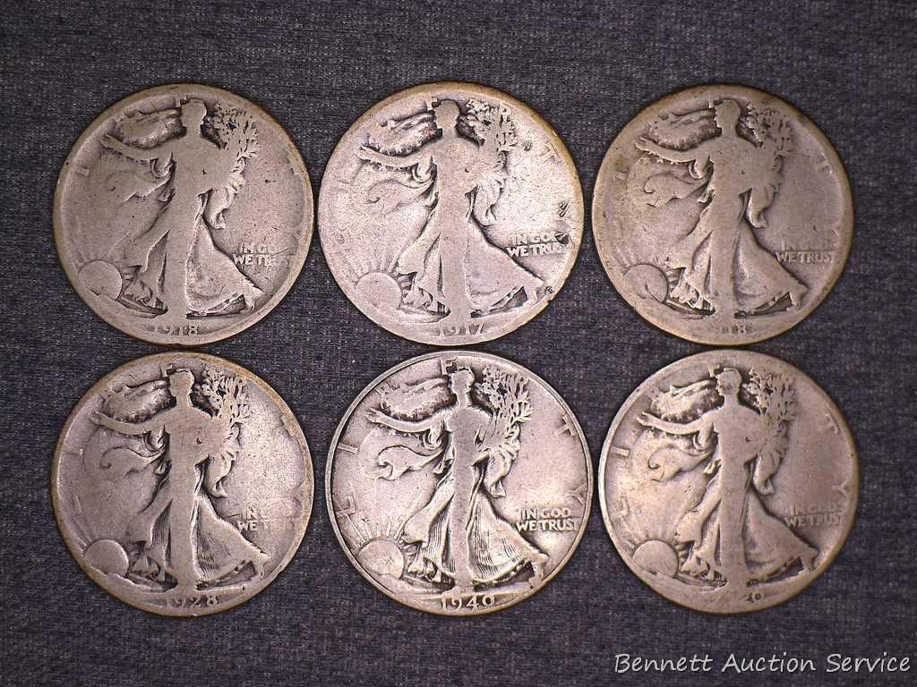 Six Walking Liberty silver half dollars including 1917, 1918-S, 1920, 1928-S and 1940.
