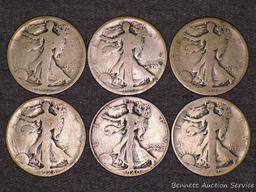 Six Walking Liberty silver half dollars including 1917, 1918-S, 1920, 1928-S and 1940.