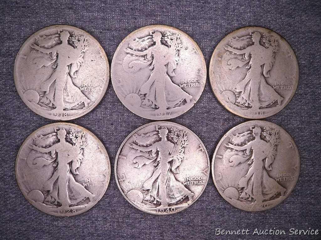 Six Walking Liberty silver half dollars including 1917, 1918-S, 1920, 1928-S and 1940.