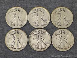 Six Walking Liberty silver half dollars including 1917, 1918-S, 1920, 1928-S and 1940.