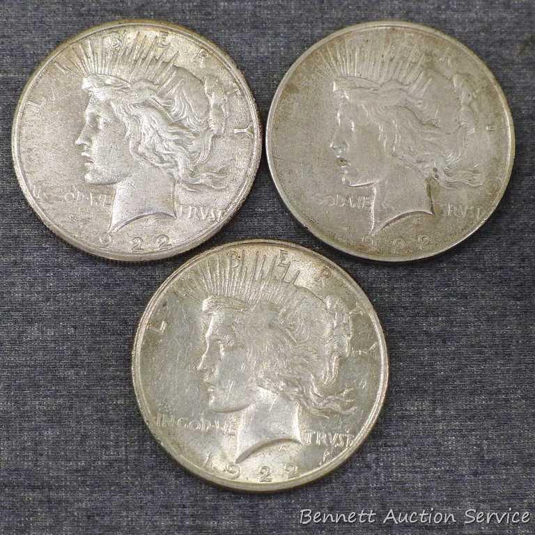 Three silver Peace dollars including 1922, 1922-S, 1922-D.