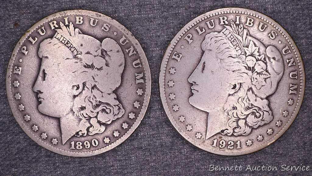 Two Morgan silver dollars including 1890-O and 1921-S.