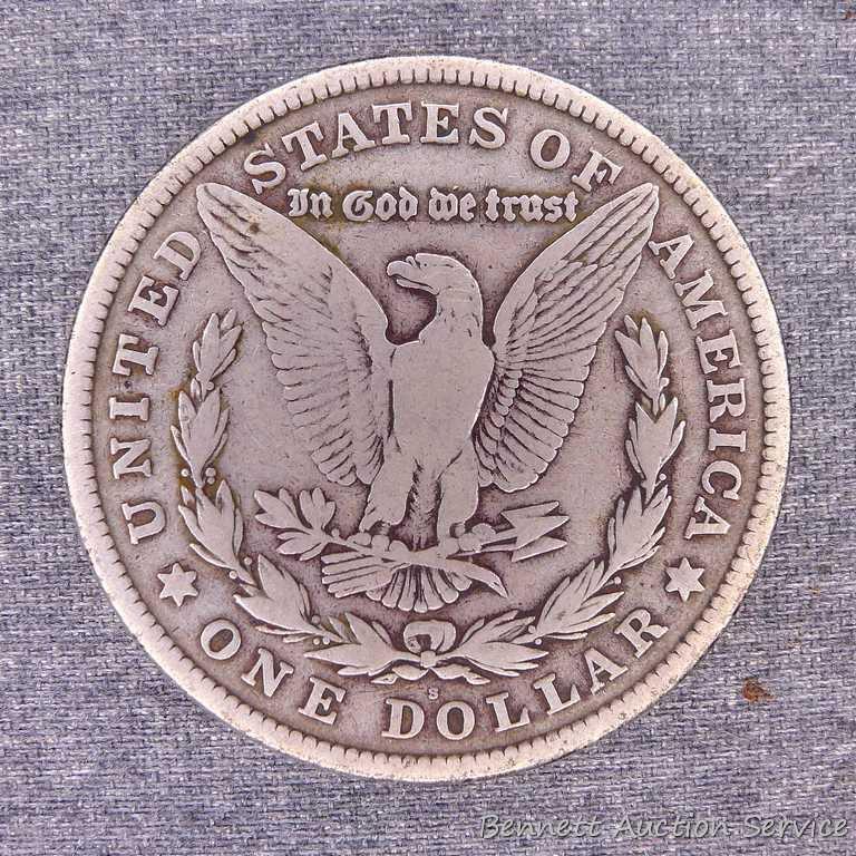 Two Morgan silver dollars including 1890-O and 1921-S.