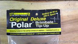 2 NIP Polaris tip-ups; NIP Original Deluxe Polar tip-up; and ice scoop.