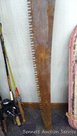 Vintage hand saw is 53" long x 7".