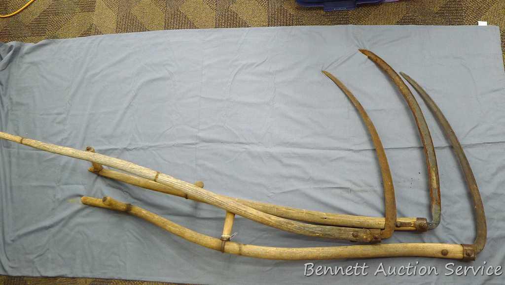 3 Vintage scythes are approx. 5' x 30". One is missing handles and one has a broken tip.