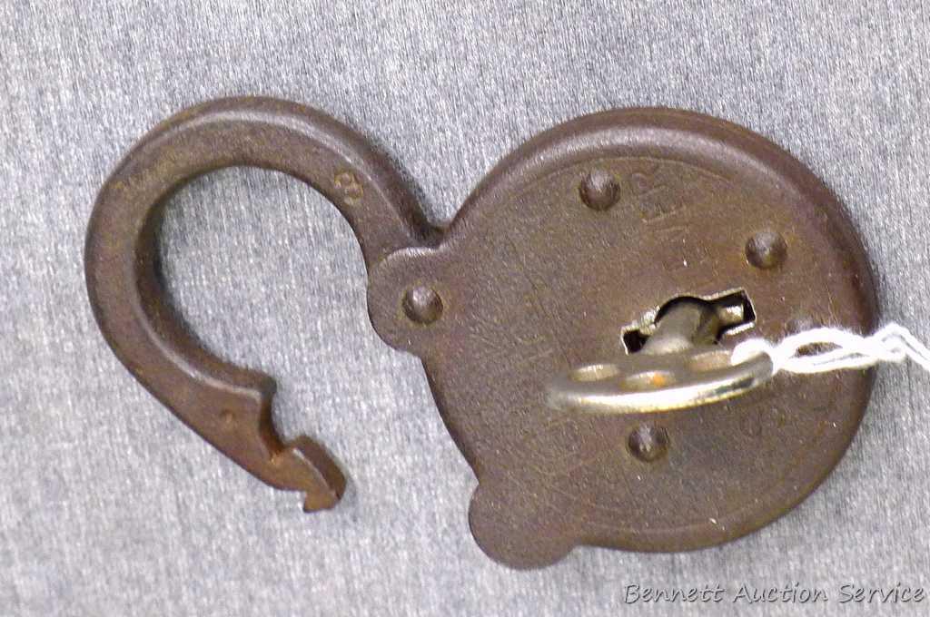 Antique iron padlocks up to 3-1/4" closed. One is marked 'O-K Six Lever' comes with key and works.