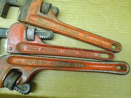 Ridgid 10" and 14" pipe wrenches, plus other 10" pipe wrench and a scraper. Jaws are in good shape.