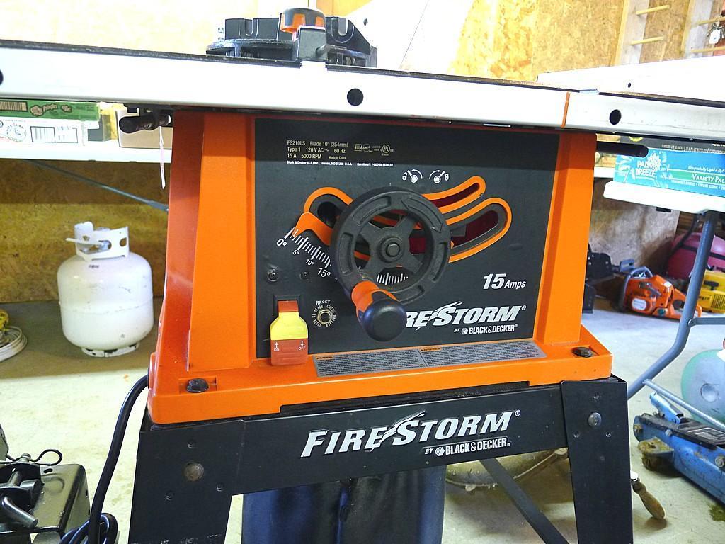 Black and Decker FireStorm 10" table saw with steel floor stand and dust collection bag. Table with