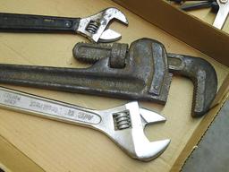 Ridgid 18" pipe wrench, jaws show wear; 12" adjustable wrench, 10" adjustable wrench.