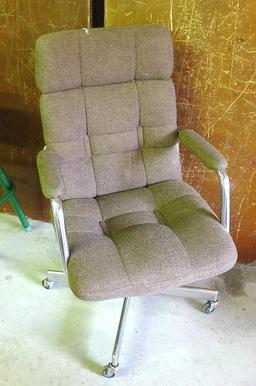 Brown padded swivel office chair. Rolls easily and is very comfortable.