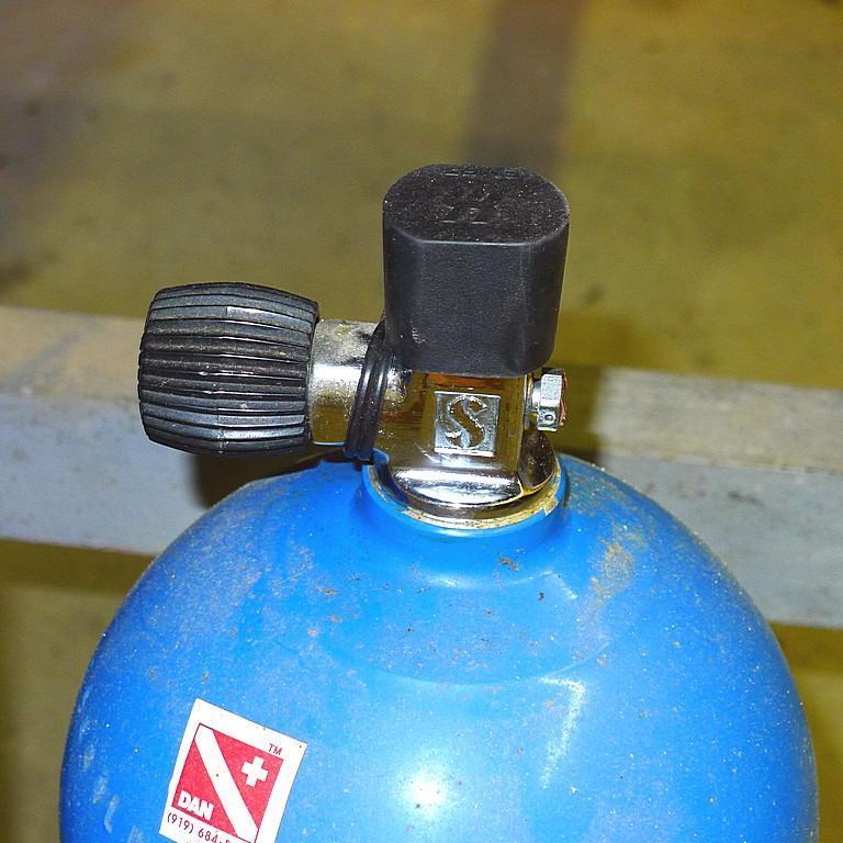 Aluminum scuba tank, 63 cu. inch capacity, has been emptied to allow shipping. Approx. 25" with valv