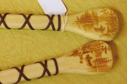 Two decorative paddles made in Wisconsin. Each paddle is 24" long.