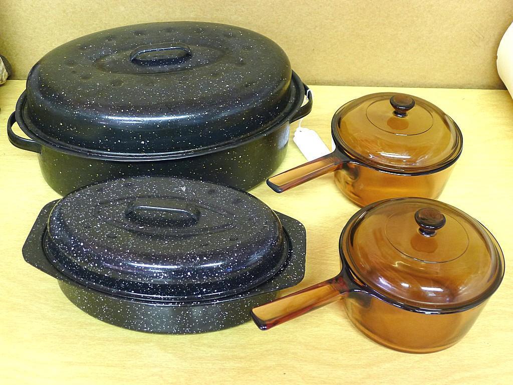 18" wide enameled roaster, smaller roaster, two glass Vision by Corning glass saucepans with lids.