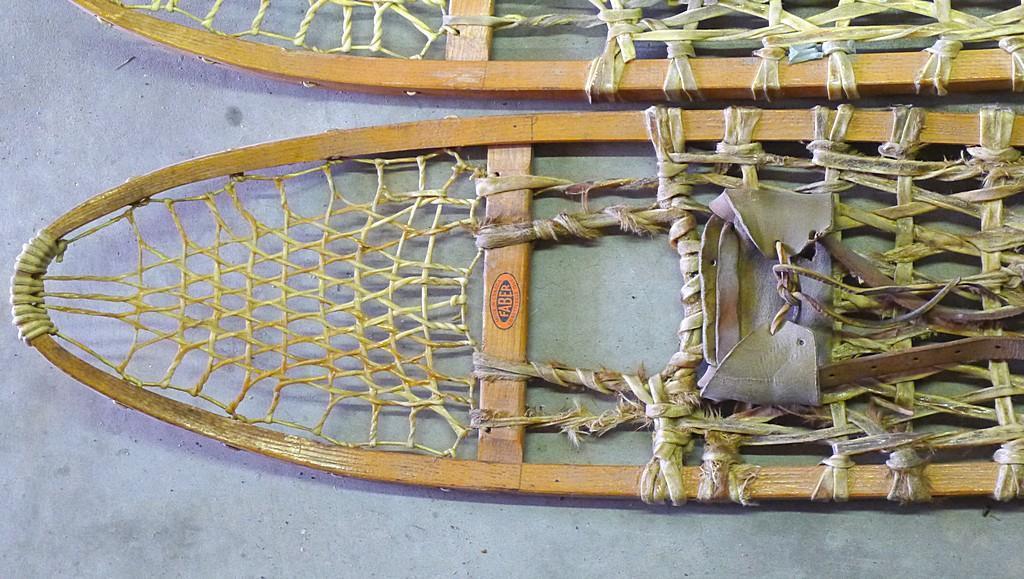 Faber snowshoes with bindings made in Canada. 10" x 56". Lacing has be well repaired. Nice