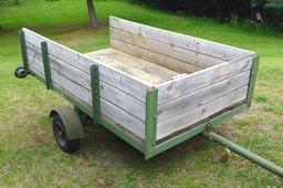 Two wheel metal framed trailer with wood sides and bottom. Approx. 7' x 4' x 17" high. Tire size is