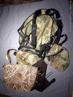 Bucklick Creek turkey hunting vest with foldout seat and side pouches; another camouflage hunting