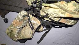 Bucklick Creek turkey hunting vest with foldout seat and side pouches; another camouflage hunting