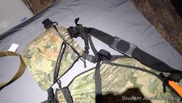 Bucklick Creek turkey hunting vest with foldout seat and side pouches; another camouflage hunting