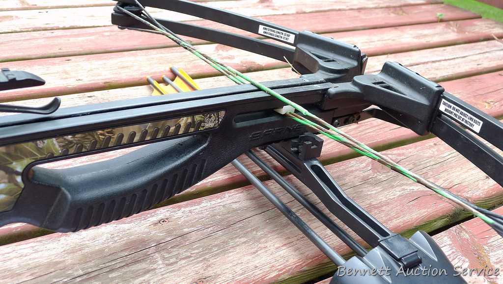 Barnett Jackal cross bow with three bolts, quiver, cocking string and Barnett triple dot optic.