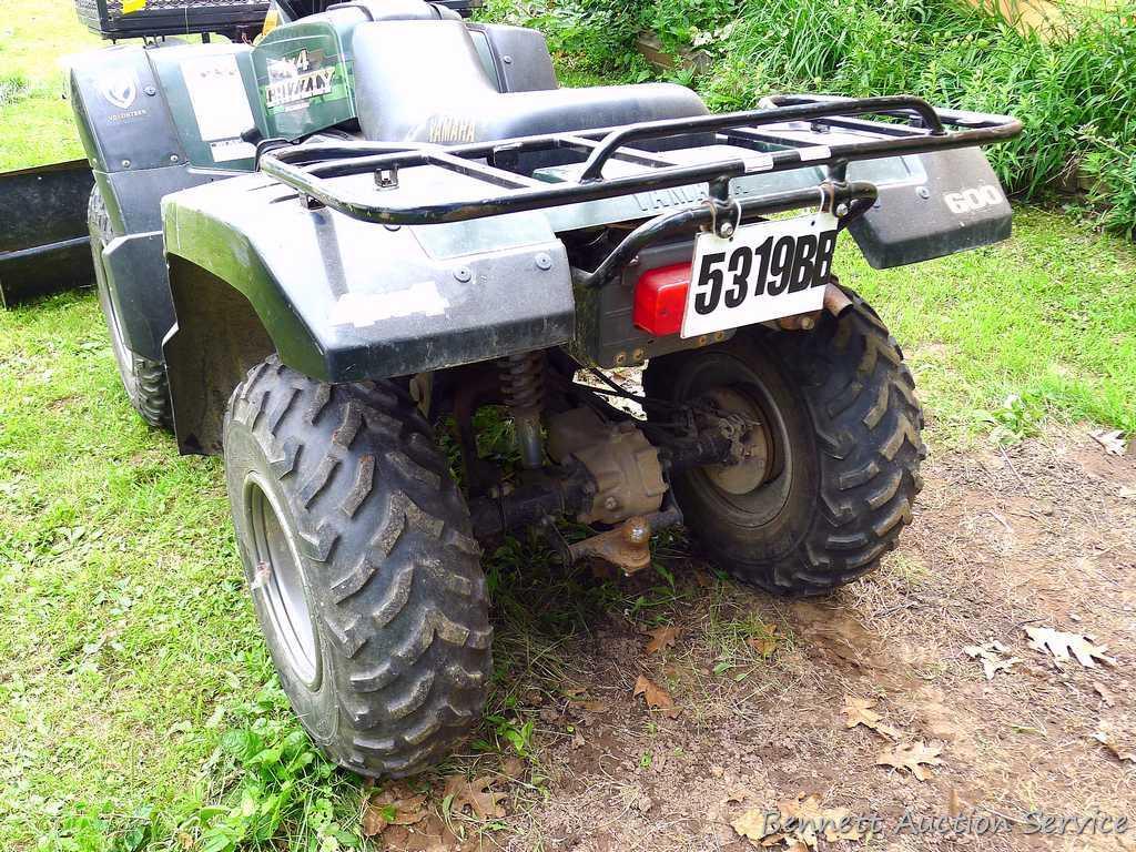 Yamaha Grizzly 4 x 4 ATV, 600cc with on demand 4 wheel drive, winch and 5 ft. snowplow. Machine