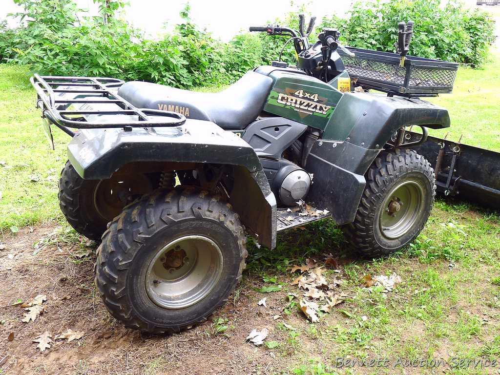 Yamaha Grizzly 4 x 4 ATV, 600cc with on demand 4 wheel drive, winch and 5 ft. snowplow. Machine