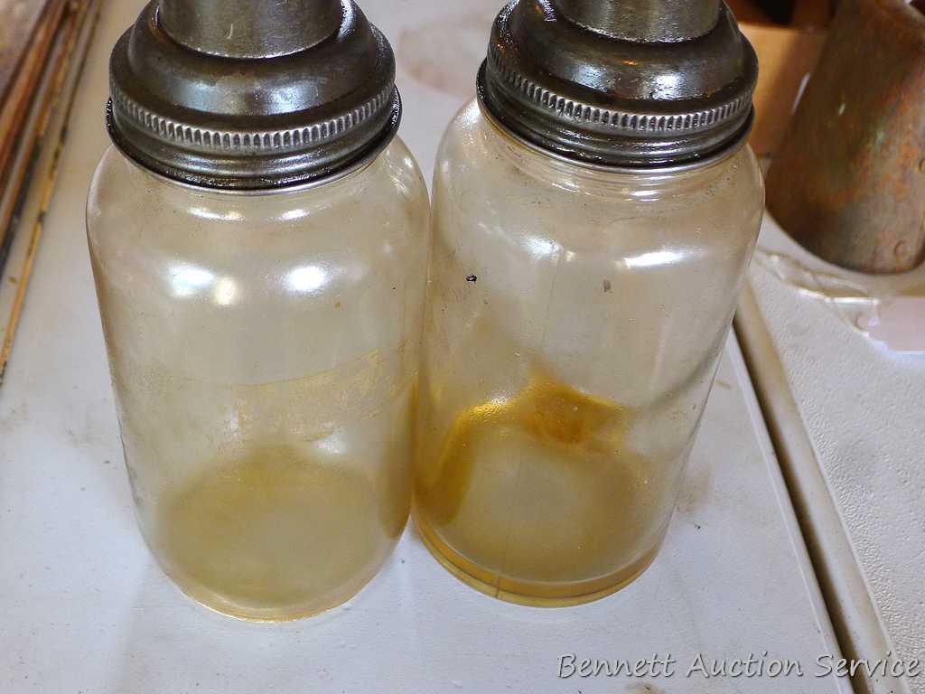 2 quart oil bottles with spouts marked "Amco".