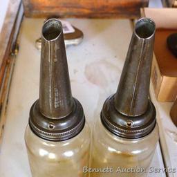 2 quart oil bottles with spouts marked "Amco".