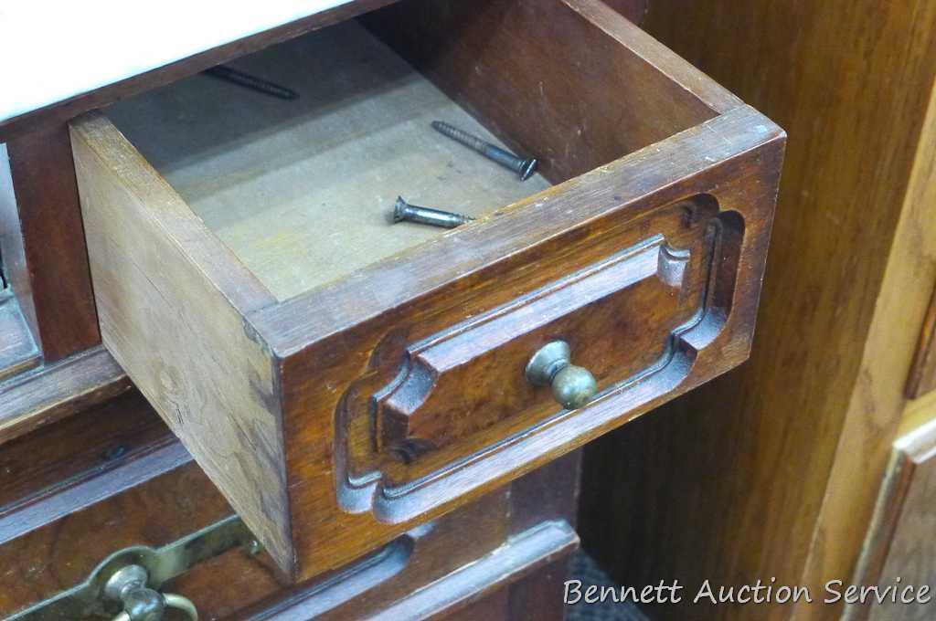 Antique marble topped vanity or dresser with mirror. Mirror silvering has streaking and other