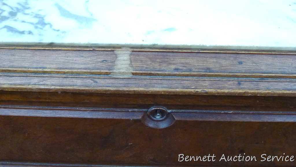 Antique marble topped vanity or dresser with mirror. Mirror silvering has streaking and other