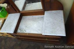 Antique marble topped vanity or dresser with mirror. Mirror silvering has streaking and other