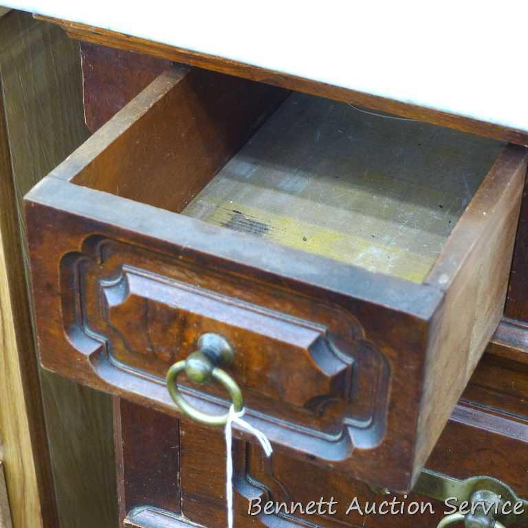 Antique marble topped vanity or dresser with mirror. Mirror silvering has streaking and other