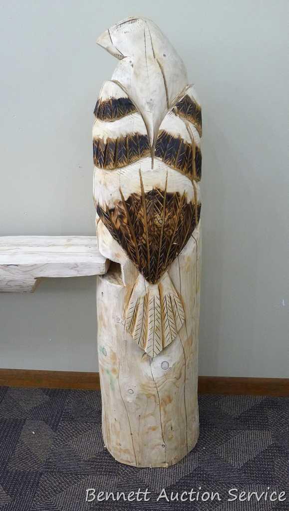 Chainsaw carved eagle shelf is 51" tall x 88" long x 11" deep and is donated by Andrea & Kevin