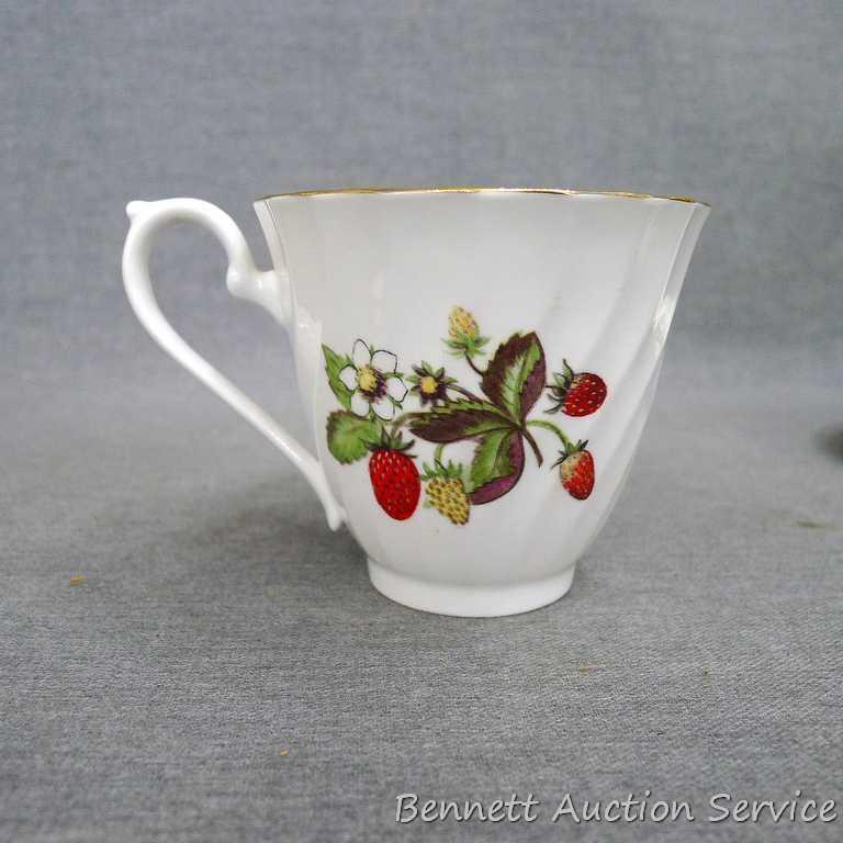 Strawberry patterned Fine Bone China tea cup with saucer was made in England, marked 'Royal Kendal'.