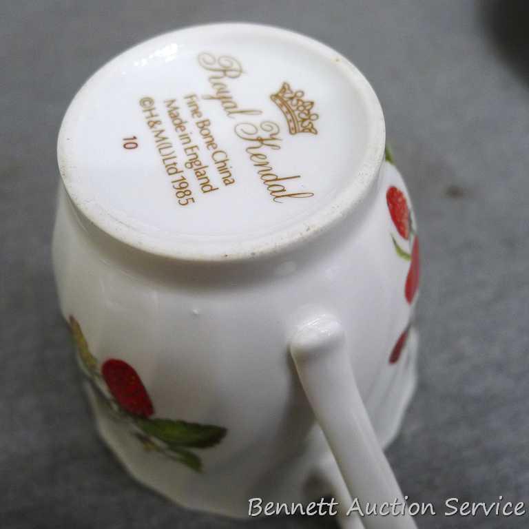 Strawberry patterned Fine Bone China tea cup with saucer was made in England, marked 'Royal Kendal'.