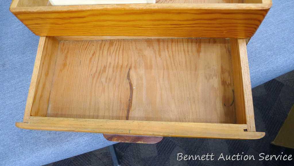 Wooden jewelry box; has a tray in the top compartment; box measures 13-3/4" x 7-1/2" x 6".