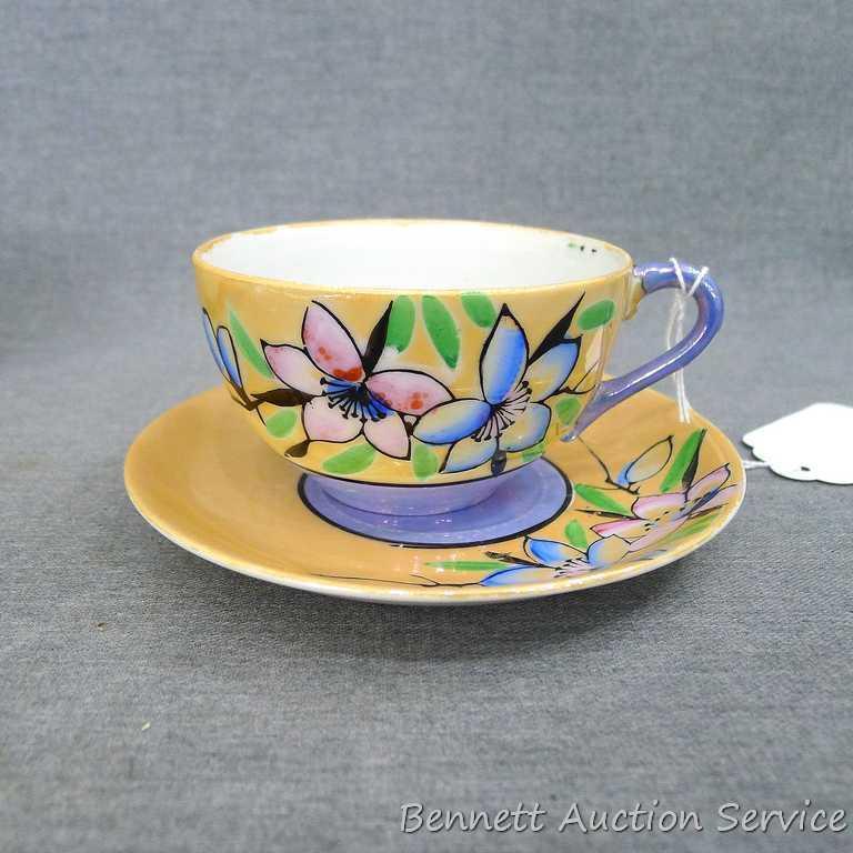 Cup and saucer hand painted in Japan, saucer measures 5-1/2" diameter, cup is 3-1/2" diameter by 2"