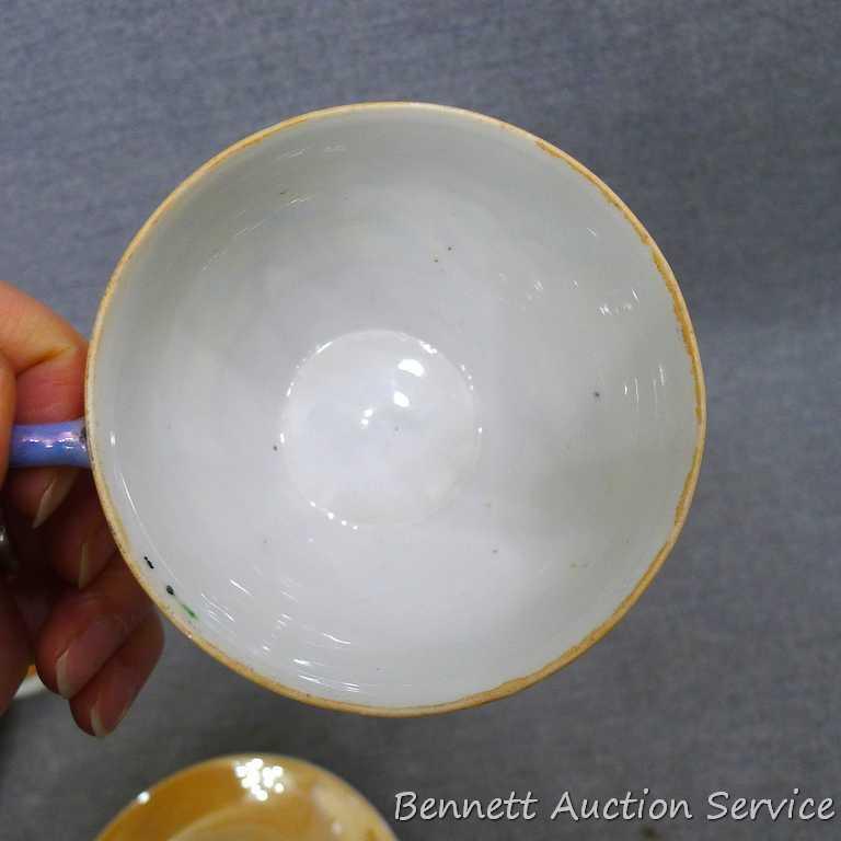 Cup and saucer hand painted in Japan, saucer measures 5-1/2" diameter, cup is 3-1/2" diameter by 2"