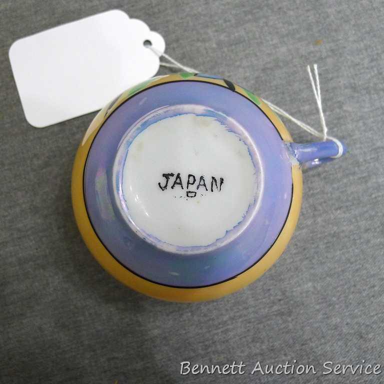 Cup and saucer hand painted in Japan, saucer measures 5-1/2" diameter, cup is 3-1/2" diameter by 2"