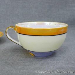 Cup and saucer hand painted in Japan, saucer measures 5-1/2" diameter, cup is 3-1/2" diameter by 2"