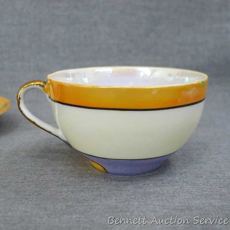 Cup and saucer hand painted in Japan, saucer measures 5-1/2" diameter, cup is 3-1/2" diameter by 2"