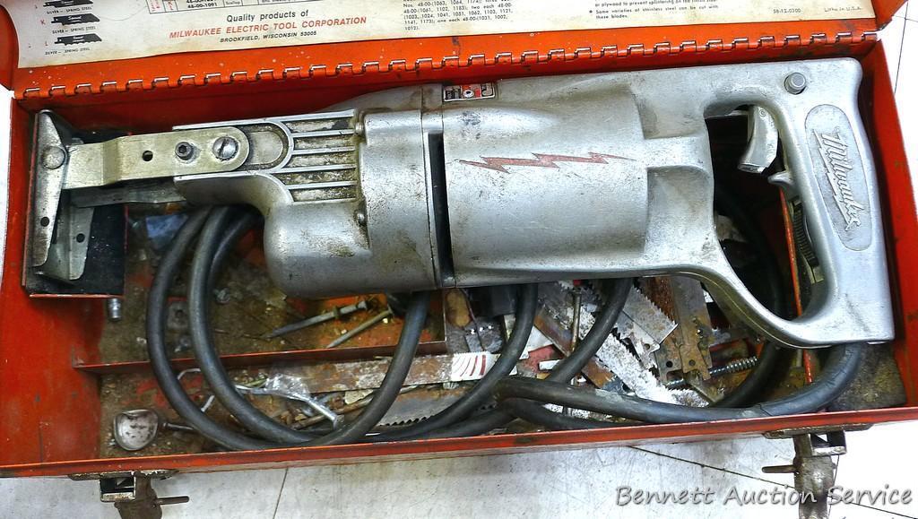 Vintage Milwaukee Sawzall is all metal and comes with original case and some blades. Runs.