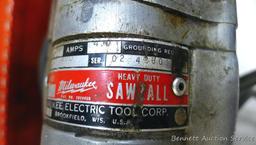 Vintage Milwaukee Sawzall is all metal and comes with original case and some blades. Runs.