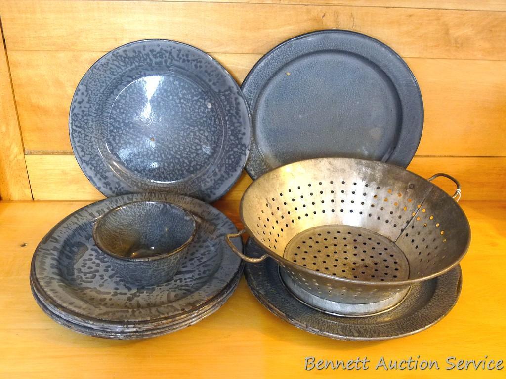 Nice collection of graniteware dinner plates, plus a matching cup and a lightweight metal colander.